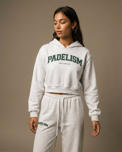 Cropped pullover hoodie in light gray with green logo print on back and hood