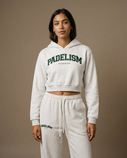 Cropped pullover hoodie in light gray with green logo text on chest and hood